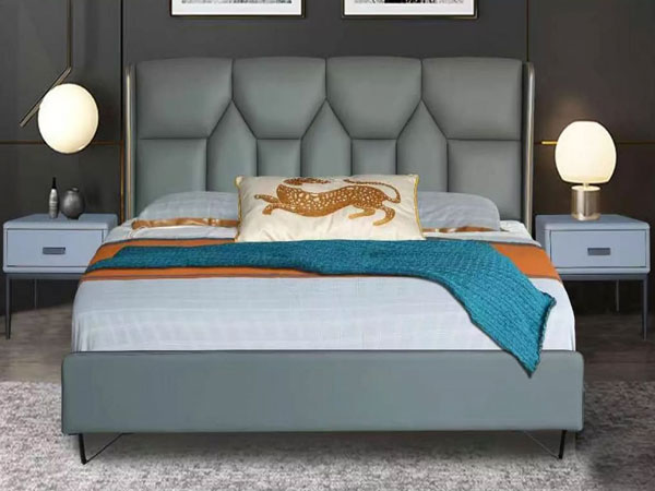 What precautions should be taken when maintaining a leather upholstered bed?